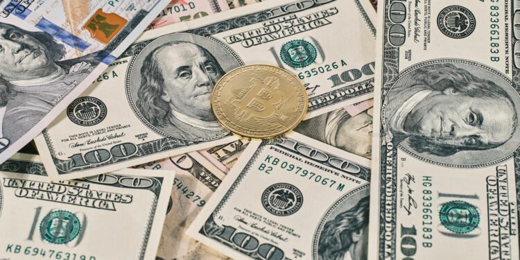 Digital currency symbols with a background of US dollar bills and a warning sign.