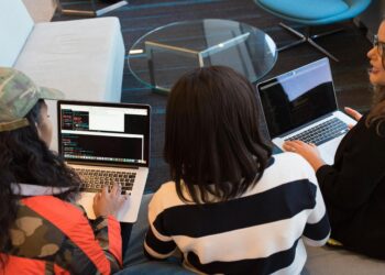 Participants collaborating on blockchain projects at the TRON DAO-sponsored hackathon.