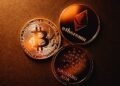A graphic showing Cardano's logo alongside Bitcoin symbols and scaling charts.