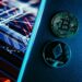 Graphic showing digital currency symbols and AI technology in a financial context.