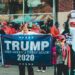 A bustling campaign event with supporters holding signs for the Ohio Senate race.