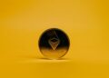 A graphic showing Ethereum logo with a digital counter nearing 70,000 ETH staked.