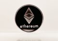 Logo of AITECH Cloud Network with Ethereum symbols illustrating rebranding in crypto finance.