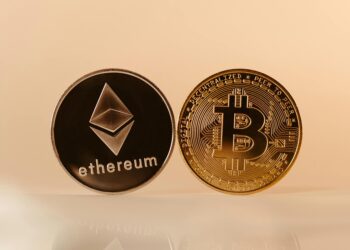 Digital currencies Bitcoin and Ethereum displayed alongside a Charles Schwab logo.