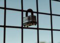A security lock symbol overlaying a digital interface related to AI access restrictions.