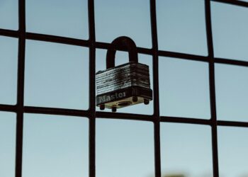 A security lock symbol overlaying a digital interface related to AI access restrictions.