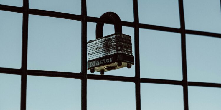 A security lock symbol overlaying a digital interface related to AI access restrictions.