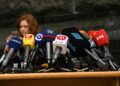 A South Korean official discusses new regulations for stablecoins at a press conference.