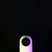 Xiaomi MiMo 2.5 Pro AI device featuring vision sensors against a colorful tech backdrop.