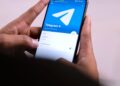 A smartphone screen displays the Agentic Wallet interface for managing Telegram AI transactions.