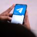 A smartphone screen displays the Agentic Wallet interface for managing Telegram AI transactions.