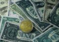 Stacks of cash and digital currency symbols reflecting financial negotiations with Iran.