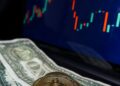 A Bitcoin logo surrounded by fluctuating graphs and dollar signs indicating market movement.