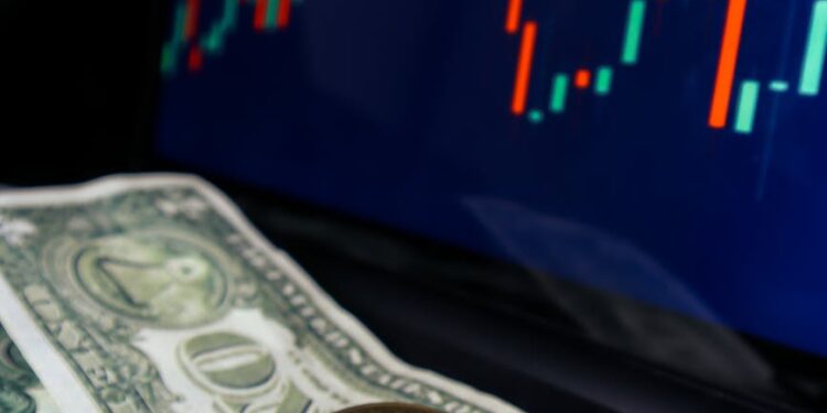 A Bitcoin logo surrounded by fluctuating graphs and dollar signs indicating market movement.