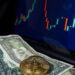 A Bitcoin logo surrounded by fluctuating graphs and dollar signs indicating market movement.