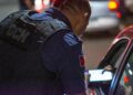 Regulators inspect a cryptocurrency trading hub during an enforcement operation.