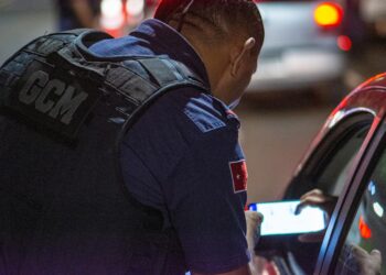 Regulators inspect a cryptocurrency trading hub during an enforcement operation.