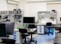 AI chips from Meta and Amazon stacked in a tech lab environment.
