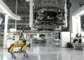 Industrial robots working collaboratively in a factory, enhanced by AI technology.