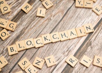 A digital representation of a blockchain ledger with tokenized fund symbols.
