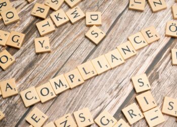 A regulatory meeting on stablecoin compliance with financial officials discussing measures.