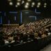 Large crowd at a cryptocurrency conference, with banners promoting Ripple's Swell 2026 event.