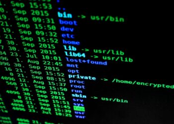 Fragments of code on a screen with a cryptocurrency wallet and a news headline about the hack.