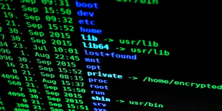 Fragments of code on a screen with a cryptocurrency wallet and a news headline about the hack.