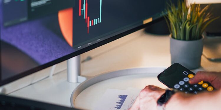 CEO sitting at a desk, surrounded by financial reports and cryptocurrency charts, looking contemplative.
