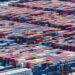 Freight containers at a shipping yard, symbolizing tokenization in real-world assets.