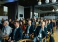 Conference attendees engage in discussions about Bitcoin's future and regulatory challenges.