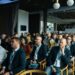 Conference attendees engage in discussions about Bitcoin's future and regulatory challenges.