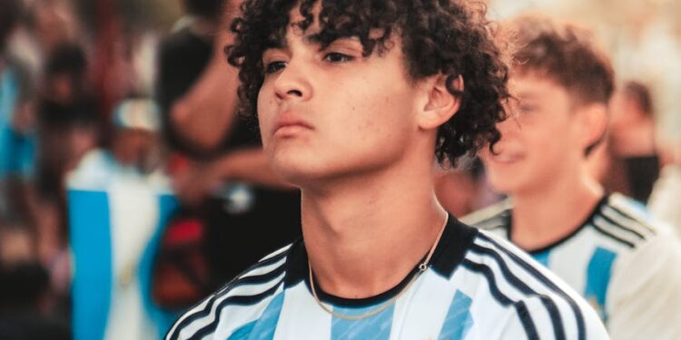 Nexo logo displayed alongside Argentina's national team jersey in promotional event.