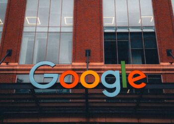 A Google logo superimposed on a Pentagon building, symbolizing AI partnership and controversy.