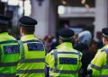 Law enforcement officers searching a London office linked to illegal crypto trading.