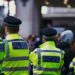 Law enforcement officers searching a London office linked to illegal crypto trading.