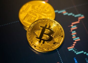 Digital illustration of cryptocurrency coins with a warning sign, symbolizing financial loss.