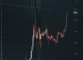 Bullish trading graph with Algorand logo and rising price chart, highlighting recent surge.