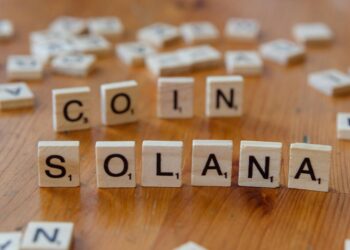 Digital currencies symbolizing USDC on blockchain networks Solana and Polygon for creators.