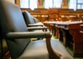 Senate Banking Committee members discuss Kevin Warsh's nomination for Fed Chair during a hearing.