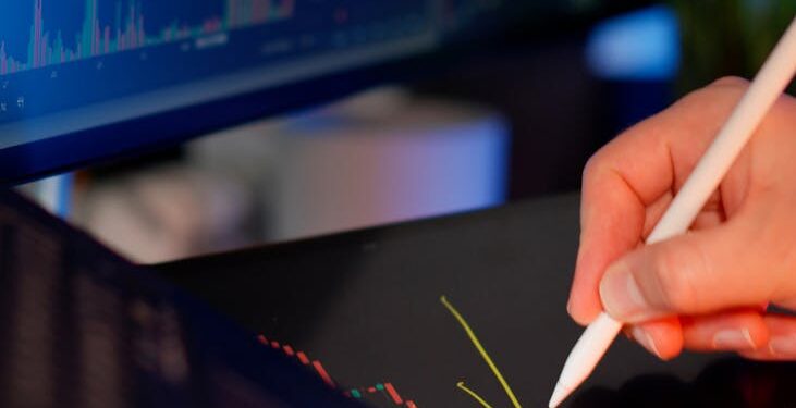 A financial analyst examining Bitcoin trends with declining charts in the background.