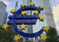 European Central Bank building with digital currency symbols superimposed.