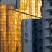 Oil tankers navigating the Strait, overlay of cryptocurrency symbols and toll signs.