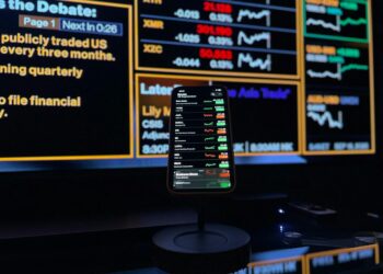 User interface displaying smart cashtags and live trading features on an iPhone screen.
