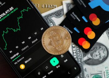 A digital wallet interface showing Mastercard integration with cryptocurrency transactions.
