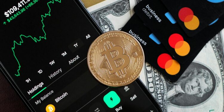 A digital wallet interface showing Mastercard integration with cryptocurrency transactions.