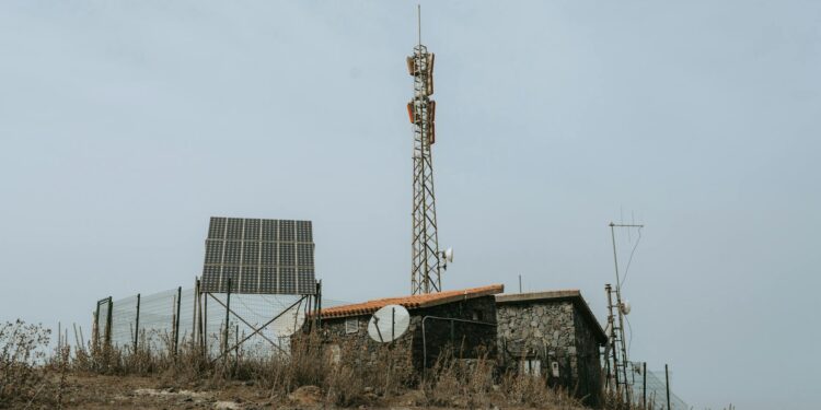 Bitcoin mining equipment with solar panels in a remote area, symbolizing off-grid technology.