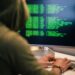 A hacker working on a computer, symbolizing the KelpDAO hack linked to Lazarus Group.