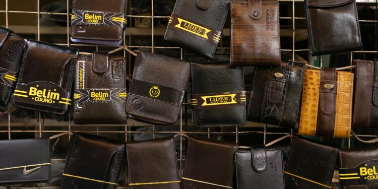 Counterfeit Ledger wallets displayed on a Chinese marketplace with warning signs highlighted.