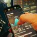A hacker's silhouette overlaid on financial data screens and crypto symbols.